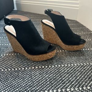 Black suede sandal on cork wedge